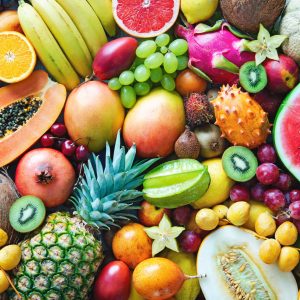 Food background. Assortment of colorful ripe tropical fruits. Top view